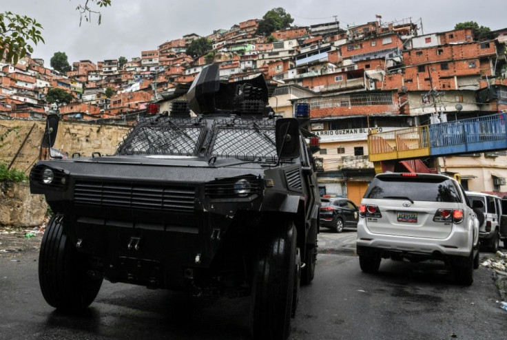 A VN-4 armored vehicle drives along one of the main streets of the Cota 905 neighborhood after two days of clashes with alleged gang members in Caracas
