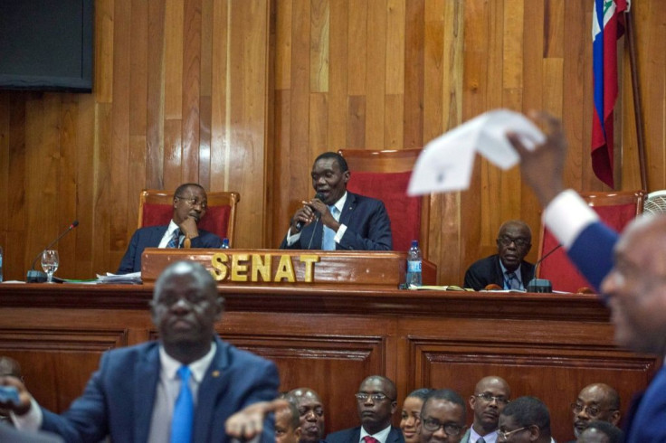 Haiti's Senate leader Joseph Lambert (C) -- seen here in 2018 -- could be the country's provisional president, but it is unclear if the resolution naming him is valid and can be enforced