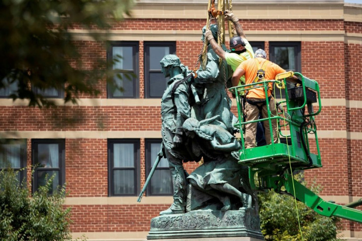A statue of Meriwether Lewis, William Clark and Sacagawea is removed from Charlottesville, Virginia on July 10, 2021