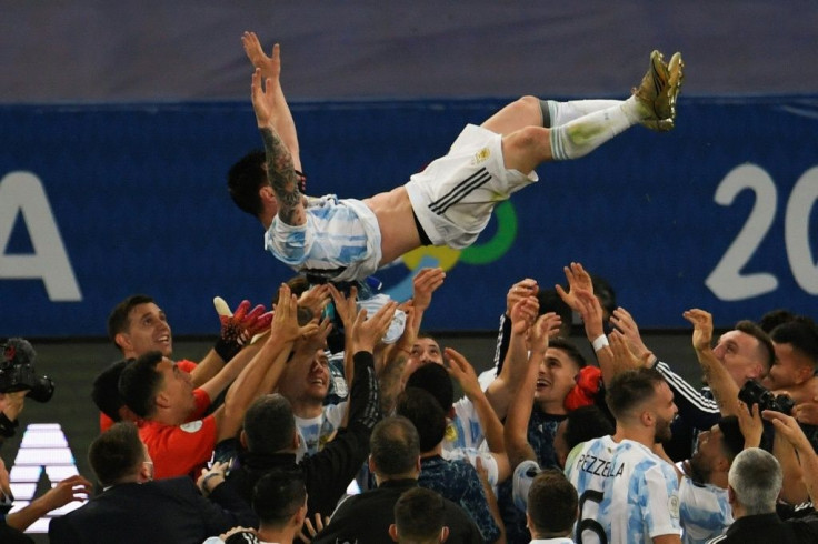 Argentina's Lionel Messi is thrown into the air by celebrating teammates after winning the 2021 Copa America