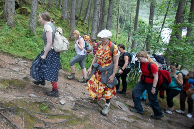 Surrounded by Austria's snow-capped peaks, two dozen spectators hike alongside lay actors who perform scenes based on the real experiences of Holocaust survivors