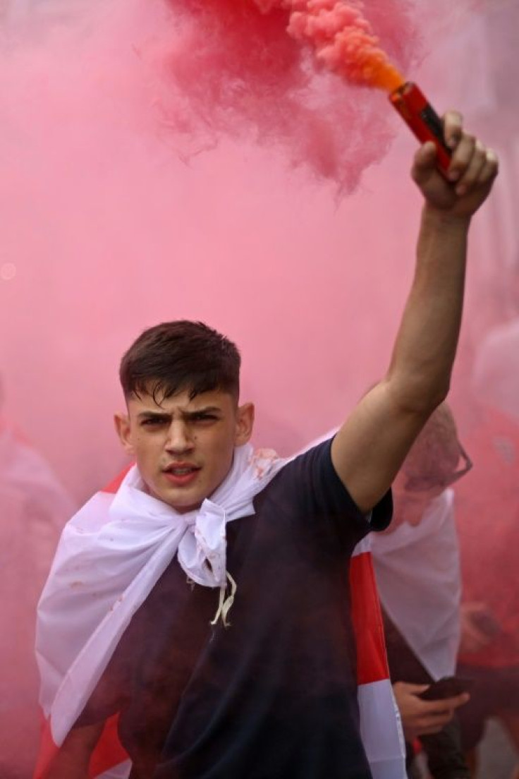 An England fan with smoke bomb outside Wembley