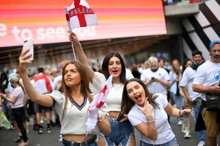 Selfie time for a trio of fans
