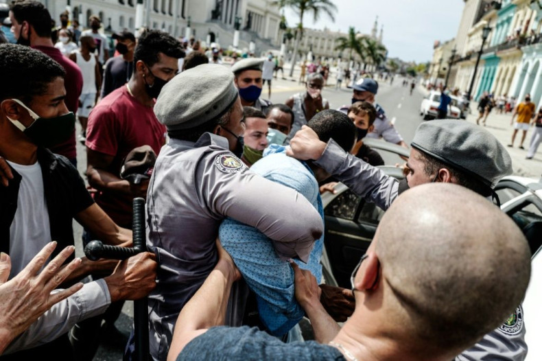A man is arrested during a demonstration against the government of Cuban President Miguel Diaz-Canel in Havana