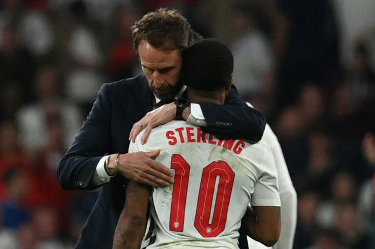 England coach Gareth Southgate embraces forward Raheem Sterling after the Euro 2020 final