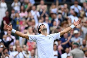 King of Centre Court: Novak Djokovic celebrates winning against Italy's Matteo Berrettini
