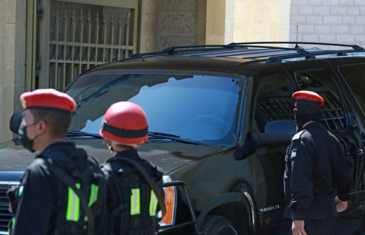A vehicle with tinted windows leaves the State Security Court in Amman, where two ex-officials accused of plotting a palace coup have been on trial