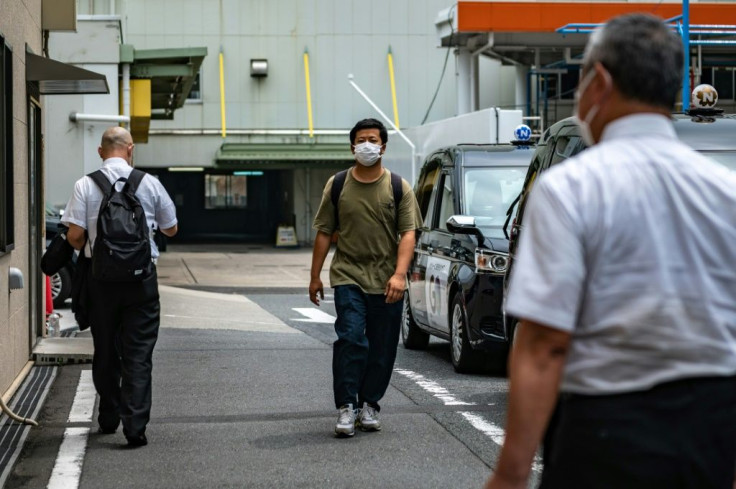 Kawaguchi turns up for work at his taxi firm dressed in a baggy T-shirt and jeans
