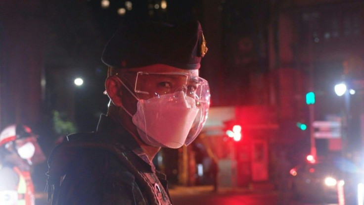 IMAGES Thai police set up check points in Bangkok as a seven-hour night curfew across the capital and nine provinces begins in an effort to curb a surge of cases of coronavirus. Thailand is grappling with a deadly third wave of infections with 9,539 new c
