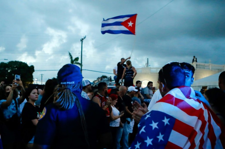 Cuban Americans demonstrate in Miami's Little Havana neighborhood, waving US and Cuban flags in support of protesters in Cuba