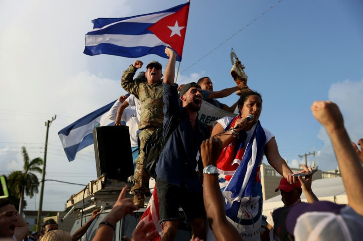 Demonstrators gathered outside Miami's Cafe Versailles, a popular haunt for Cuban Americans in Miami's Little Havana neighborhood