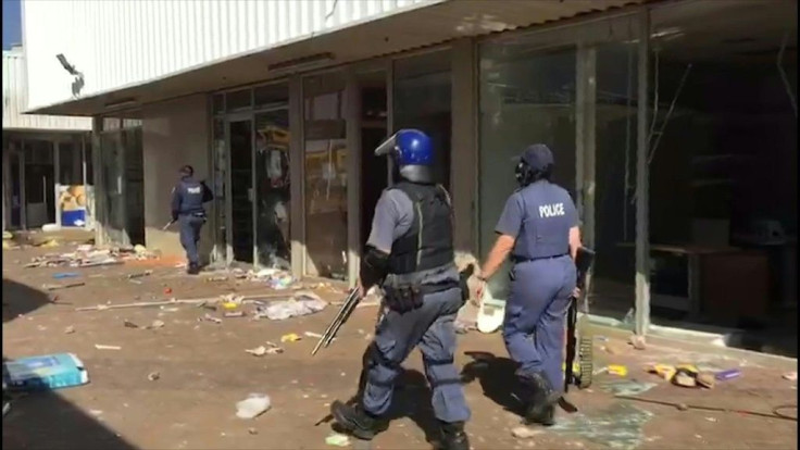 In Katlehong, south of Johannesburg, and in Durban city central in KwaZulu-Natal, hundreds of people took to the streets and looted shopping centres and businesses.