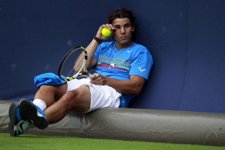 Nadal of Spain takes a break during a training session at the Queen&#039;s Club Championships in west London