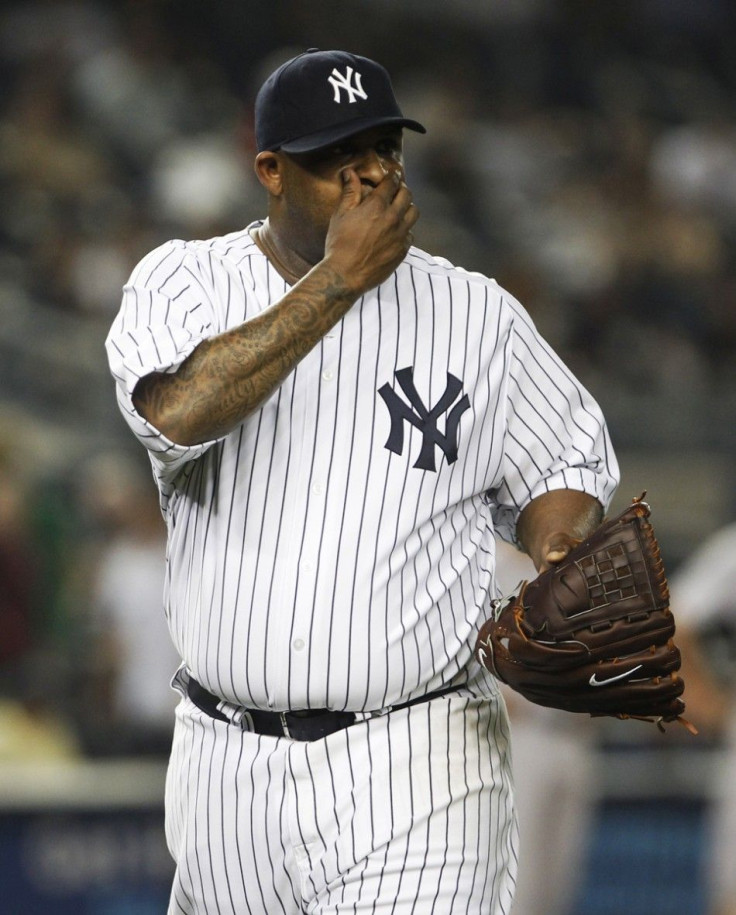 CC Sabathia, who had until midnight to opt out of his existing four-year, $92 million deal, announced in a video that he and the New York Yankees agreed on a contract extension that will keep him from testing free agency and have him stay until at 