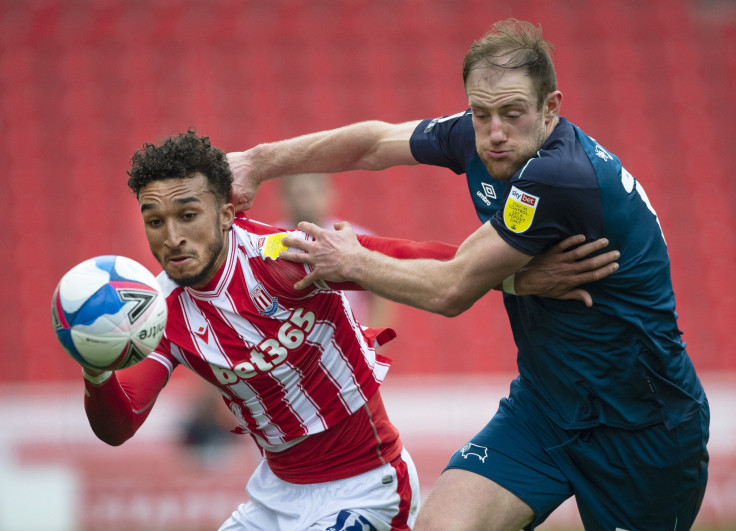 Jacob Brown of Stoke City and Matthew Clarke of Derby County 