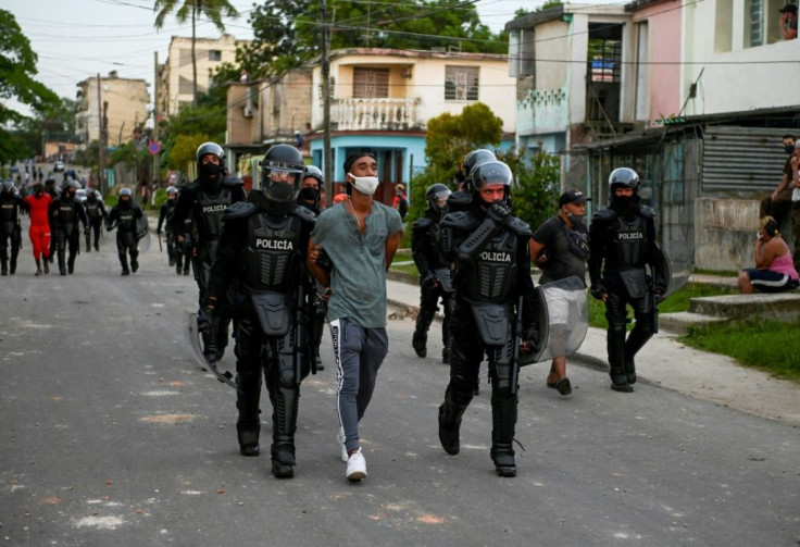 Cuban forces have arrested dozens following unprecedented anti-government protests