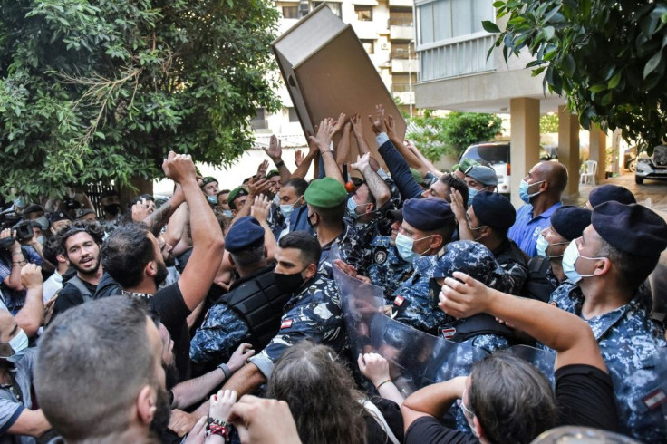 Protestors brought coffins as symbols of their loved ones lost in last year's enormous August 4 explosion