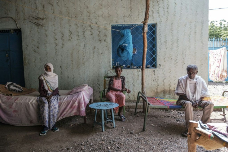 Tesfaye Weldegebriel (R) with members of his family in Humera, says he feared for his life when fighting broke out in November
