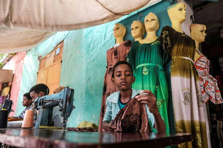 Boys work as tailors in a market in the Tigrayan city of Humera