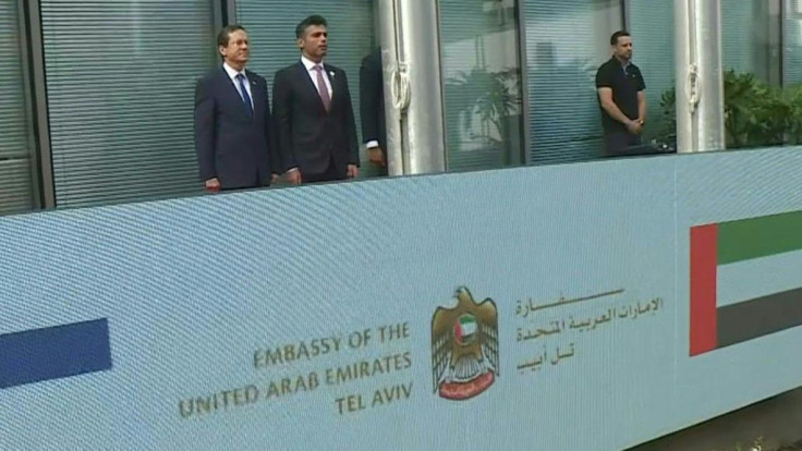 IMAGES The first UAE embassador to Israeli raises the Emirati flag at the flag raising ceremony during the official opening of the the United Arab Emirates embassy in Israel, housed in Tel Aviv's new stock exchange building, in the latest step to formalis