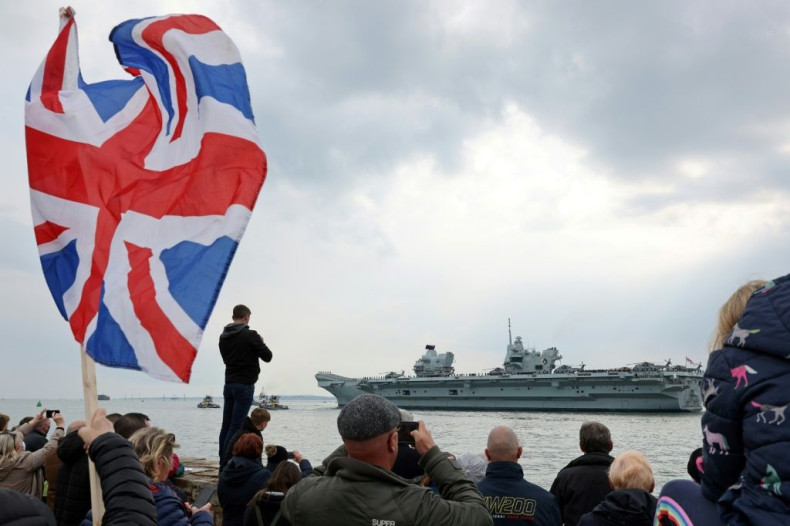 The Royal Navy's flagship, HMS Queen Elizabeth, leaves Portsmouth Naval Base on the south coast of England, on May 1