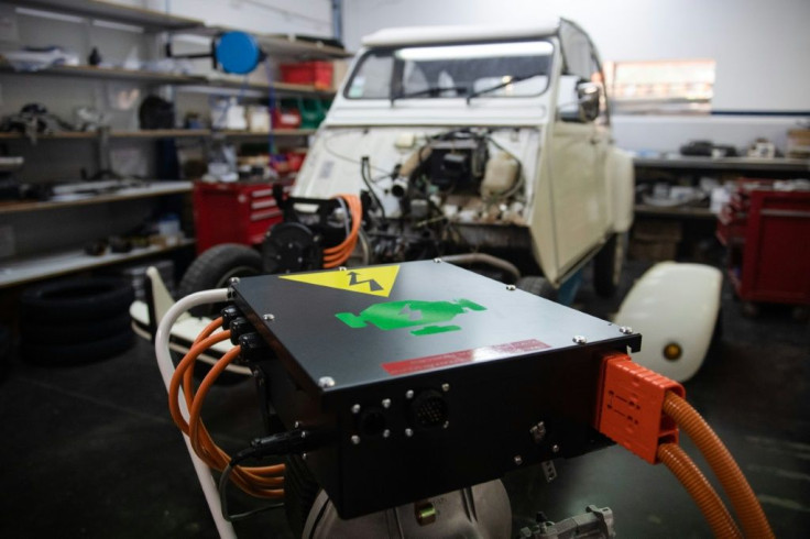 A classic Citroen 2CV getting retrofitted with an electric motor and battery pack