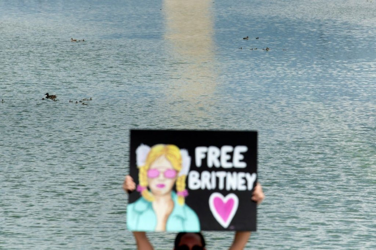 A woman holds a "Free Britney" sign during a rally in Washington in front of the Lincoln Memorial protesting the conservatorship of Britney Spears