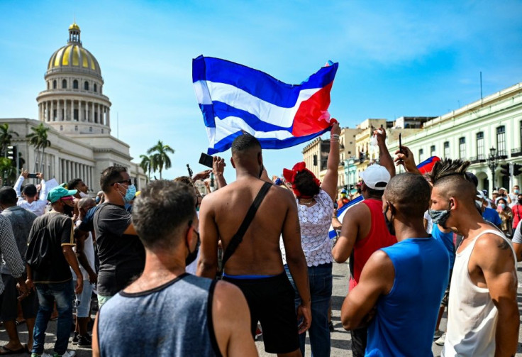Cubans are seen outside Havana's Capitol during a demonstration against the government of Cuban President Miguel Diaz-Canel in Havana, on July 11, 2021
