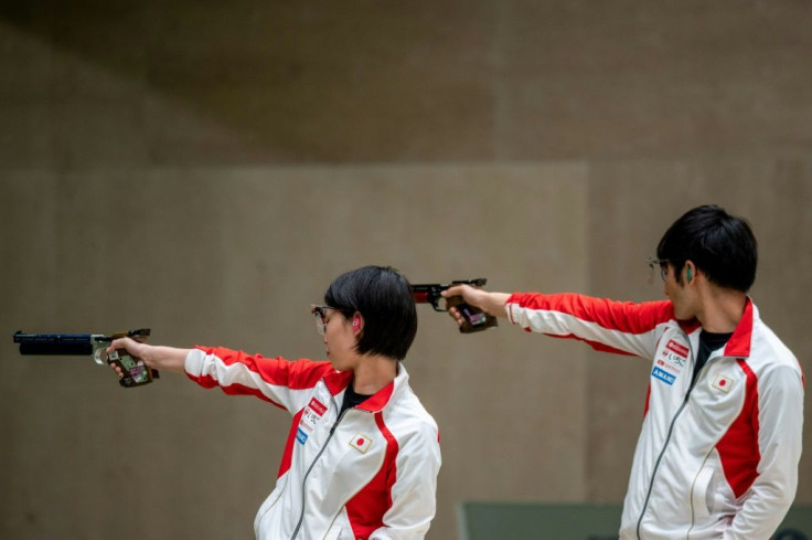 Friendly fire: Satoko Yamada (L) and Seiji Morikawa of Japan compete in 10m pistol test event in Tokyo in May