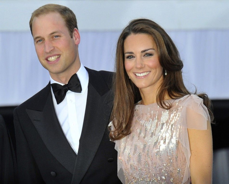Britain&#039;s Prince William and his wife Catherine, Duchess of Cambridge pose for photographers as they arrive for a charity dinner at Kensington Palace in London June 9, 2011.