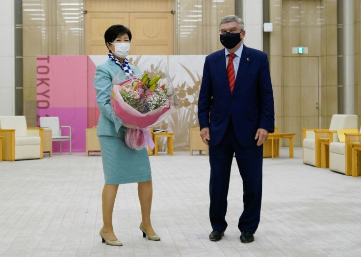 Bach (R) said a trip to the Olympic Village had convinced him that anti-virus rules are 'in place, and they are working, and they are enforced'