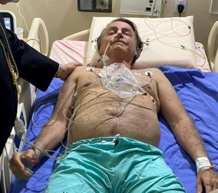 This handout photo obtained from the Twitter account of Brazil's President Jair Bolsonaro (@jairbolsonaro), shows Bolsonaro on his hospital bed in Brasilia on July 14, 2021, after he complained of persistent hiccups