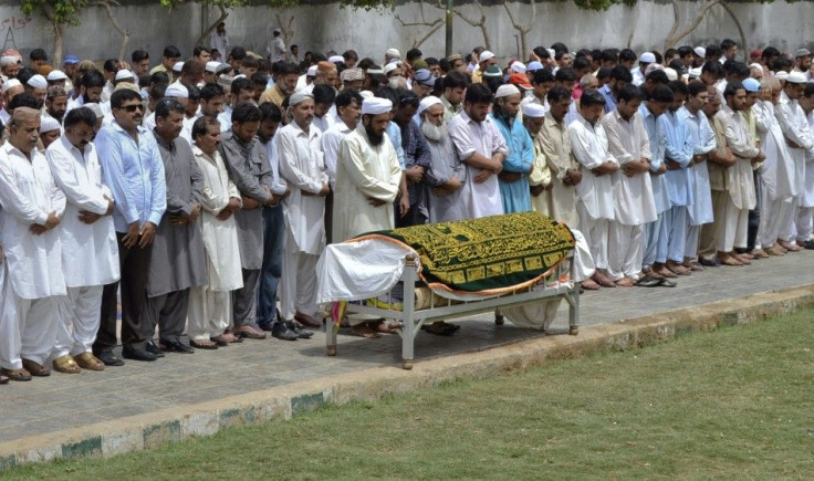 Relatives and friends offer a funeral prayer for Sarfaraz Shah, killed Wednesday by paramilitary officials, before his burial in Karachi