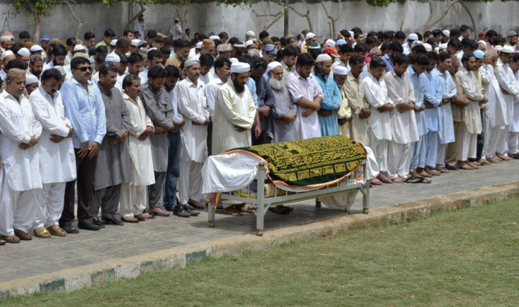 Relatives and friends offer a funeral prayer for Sarfaraz Shah, killed Wednesday by paramilitary officials, before his burial in Karachi