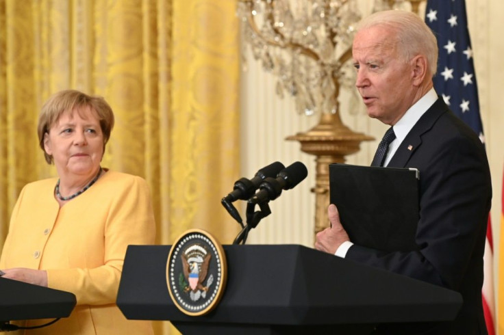 US President Joe Biden and German Chancellor Angela Merkel hold a joint press conference in the East Room of the White House