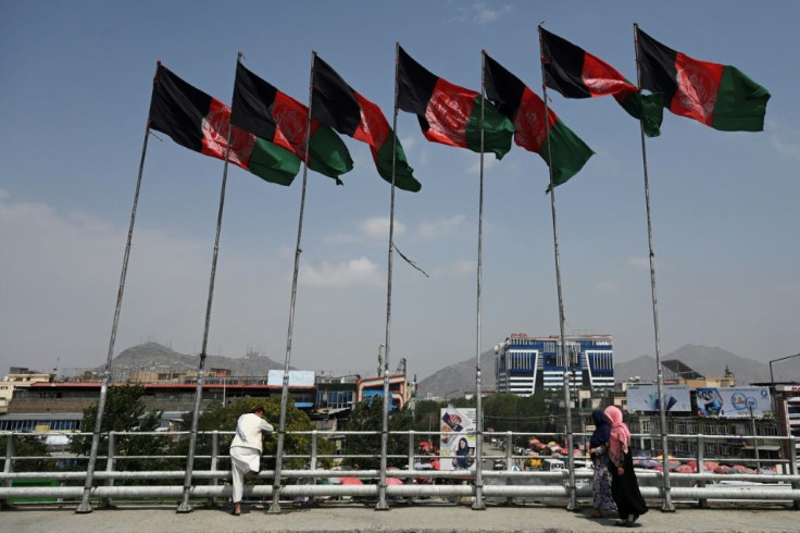Afghan flags fluttering on masts in Kabul, where the government is struggling to counter the Taliban's latest sweeping military offensive