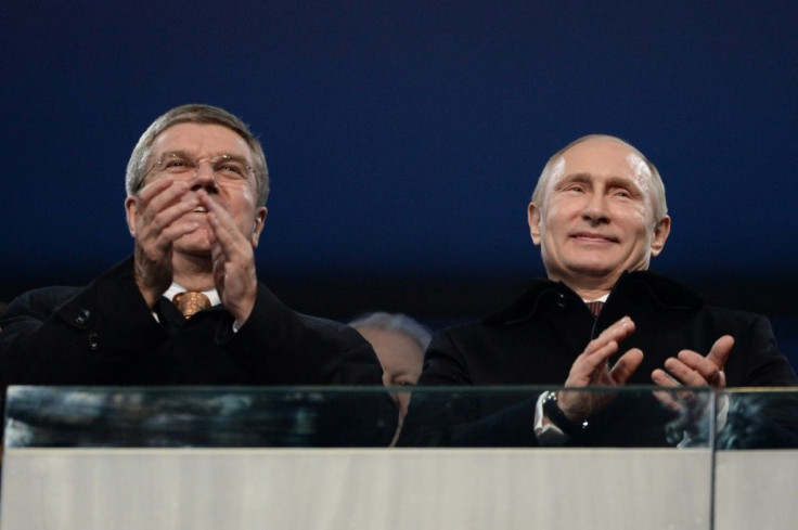 Russian President Vladimir Putin (R), seen here at the Sochi Winter Games with International Olympic Committee chief Thomas Bach, did not mention Russia's Games ban in a farewell speech to athletes