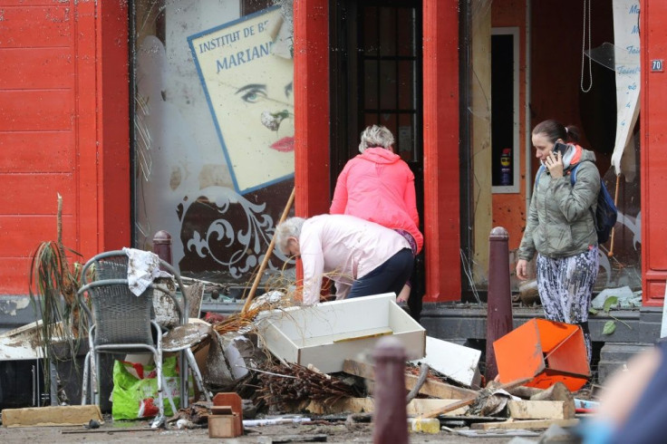Residents assessed the damage in Belgium, where more than 21,000 people had no electricity in one area