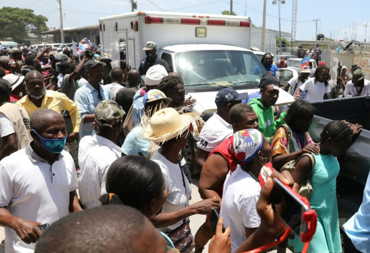 Supporters cheered the return to Haiti of the troubled nation's former president Jean-Bertrand Aristide, who spent nearly a month in Cuba for medical treatment and arrived back in Port-au-Prince following the assassination of president Jovenel Moise