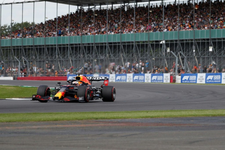 Fans in the stands: Red Bull's Max Verstappen drives at Luffield Corner during practice in front of 90,000 fans at Silverstone