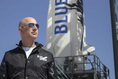 This 2015 handout photograph obtained courtesy of Blue Origin shows Jeff Bezos, founder of Blue Origin, at New Shepard's West Texas launch facility before the rocket's maiden voyageThe two companies leading the pack in the pursuit of space tourism say t
