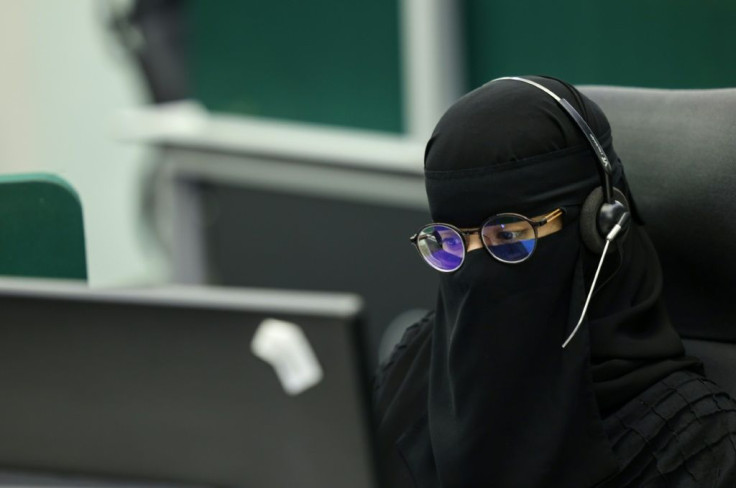 A woman works in a command-and-control room in Mecca ahead of the annual pilgrimage in the holy city