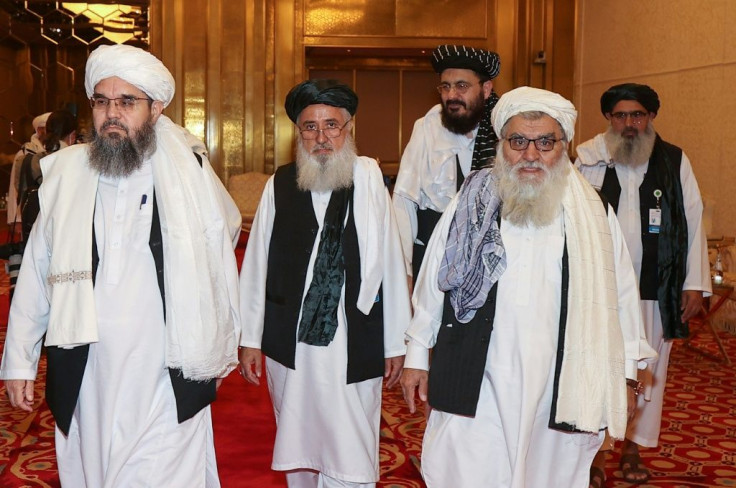 A delegation of Afghanistan's Taliban movement attends a session of peace talks with the Afghan government in the Qatari capital Doha