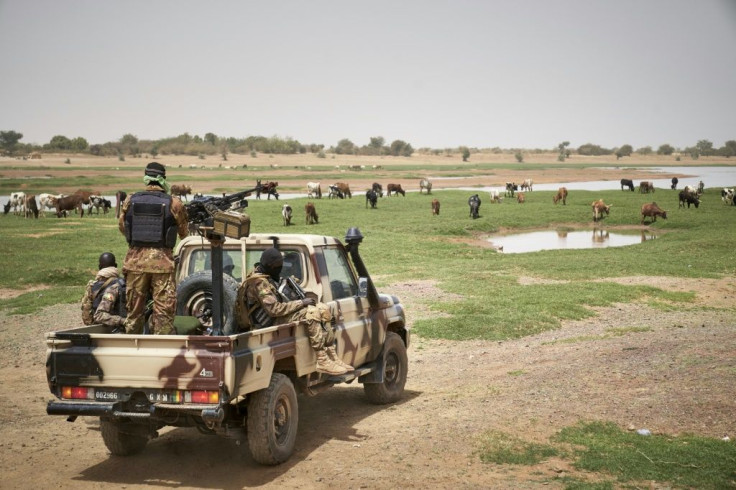 Malian soldiers on patrol. Mali has been struggling to contain an Islamist insurgency that first broke out in the north of the country in 2012 before spreading to the centre and neighbouring Burkina Faso and Niger