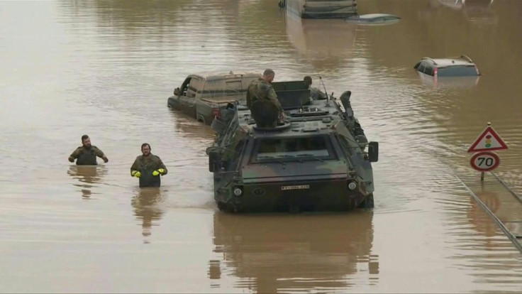 IMAGES  Germany soldiers use armoured vehicles to tow cars from a a flooded highway in Erftstadt-Blessem, western Germany. The worst floods to hit Western Europe in living memory have left more than 150 people dead and dozens more missing.