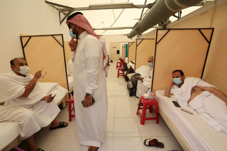 Pilgrims rest at their camp in Mina on July 18, 2021
