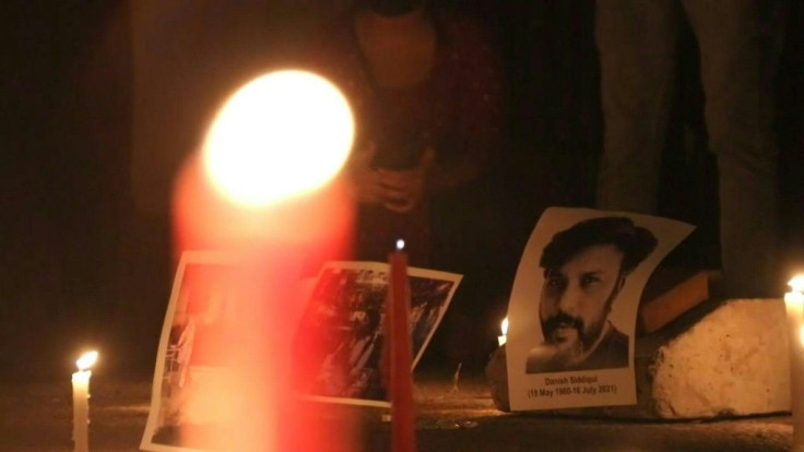 Residents and students attend a vigil at the gates of the Jamia Millia Islamia University in New Delhi to pay homage to Pulitzer Prize-winning Indian photographer Danish Siddiqui.