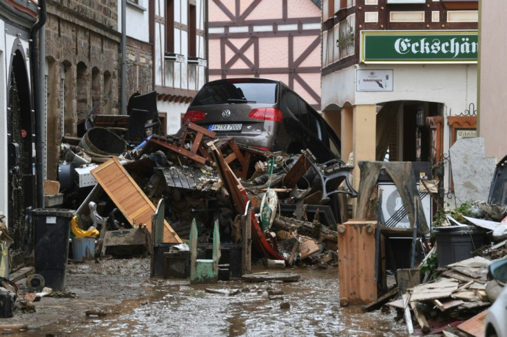 Debris and a damaged car pile up in a street in Bad Neuenahr-Ahrweiler, western Germany