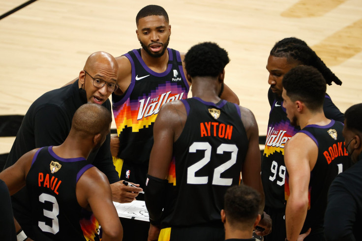 Phoenix Suns head coach Monty Williams  giving instructions to his players. 