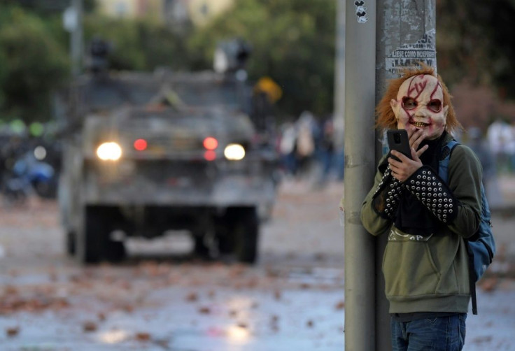 A demonstrator wearing a mask during clashes with riot police that erupted amid protests against the government of Colombian President Ivan Duque, in Bogota, on June 29, 2021